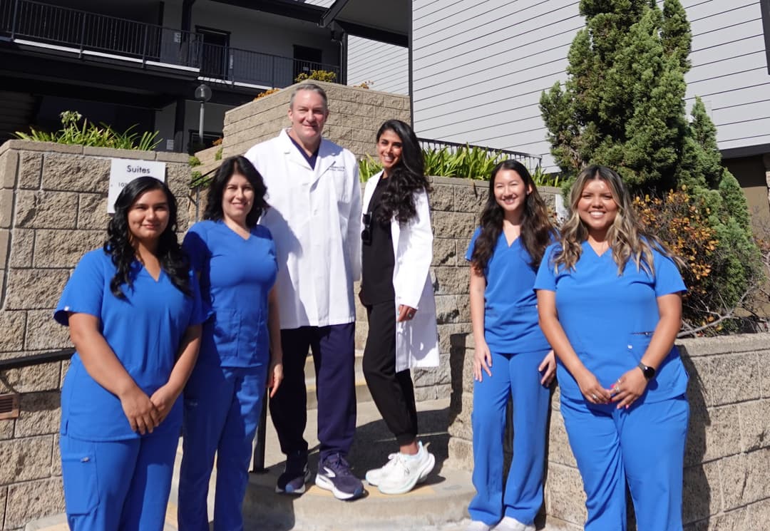 Podiatrist examining patient's foot